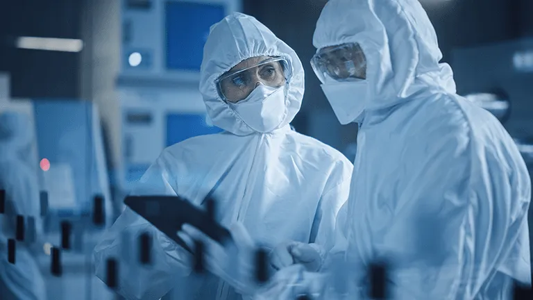 Quality control and diagnostics staff in cleanroom
